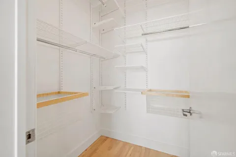 a bathroom with double sink and a mirror