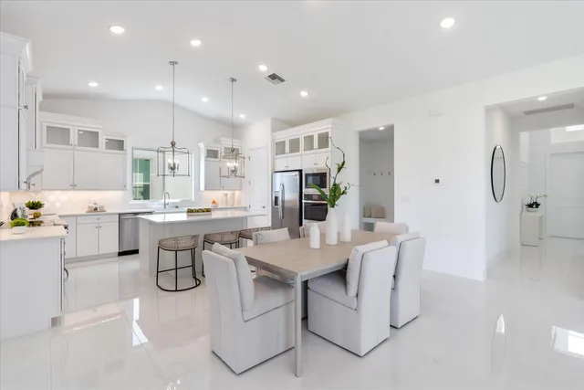a living room with furniture and flowers