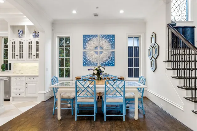 a view of a dining room with furniture and windows
