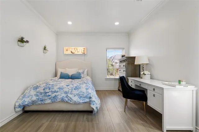 a bedroom with a bed and a table in it