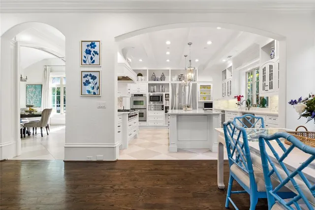 a dining room with furniture and wooden floor