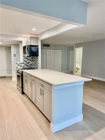 a view of a kitchen with a sink