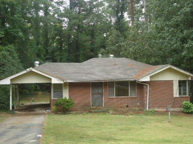 3395 Jackson Drive, Unit 19 Decatur, GA 30032 - Photo 1 of 1 a front view of a house with a garden and yard