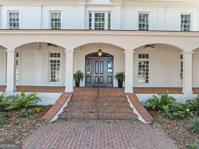 a living room with furniture a fireplace and a table