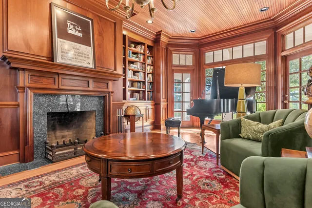 a kitchen with granite countertop a stove a sink and a wooden cabinets