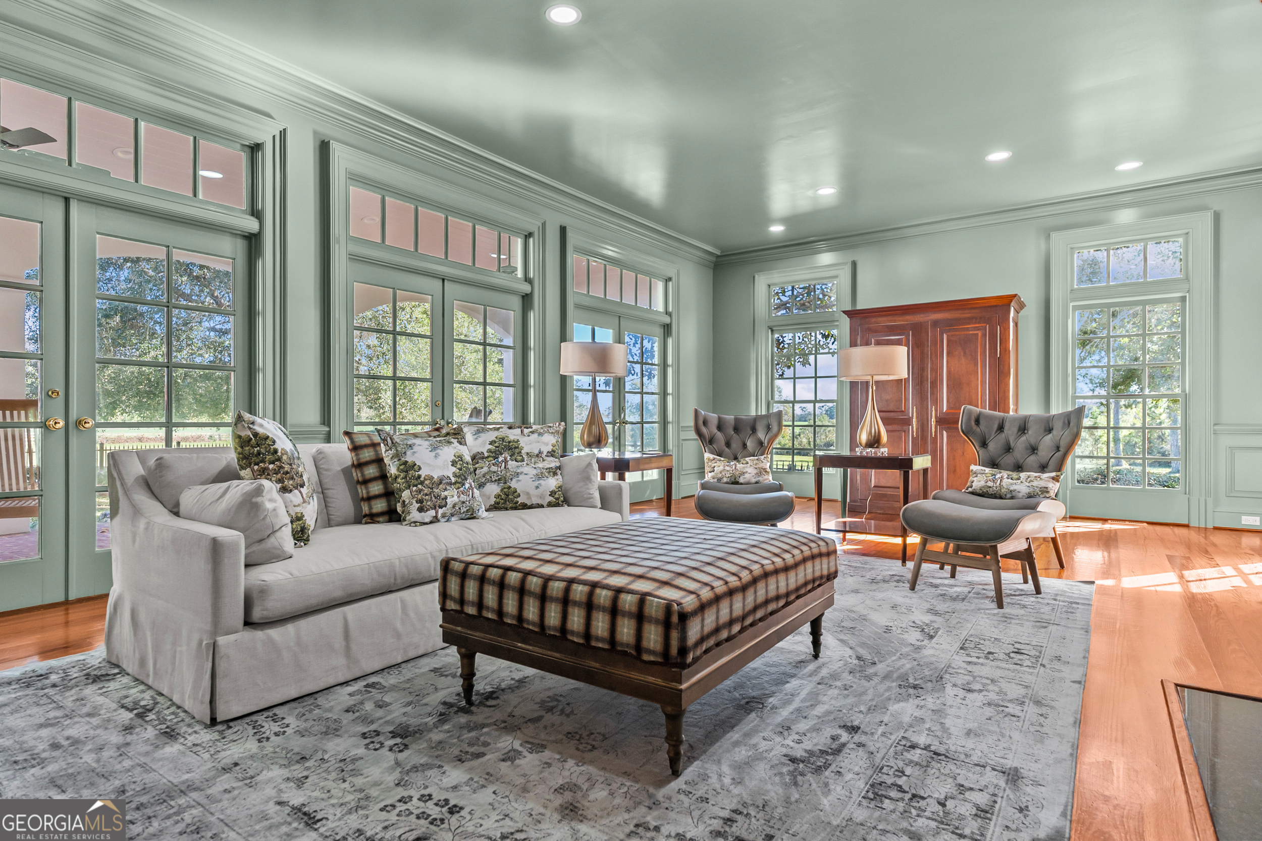 440 Ocilla Highway Fitzgerald, GA 31750 - Photo 25 of 96 a bedroom with a bed couch and wooden floor