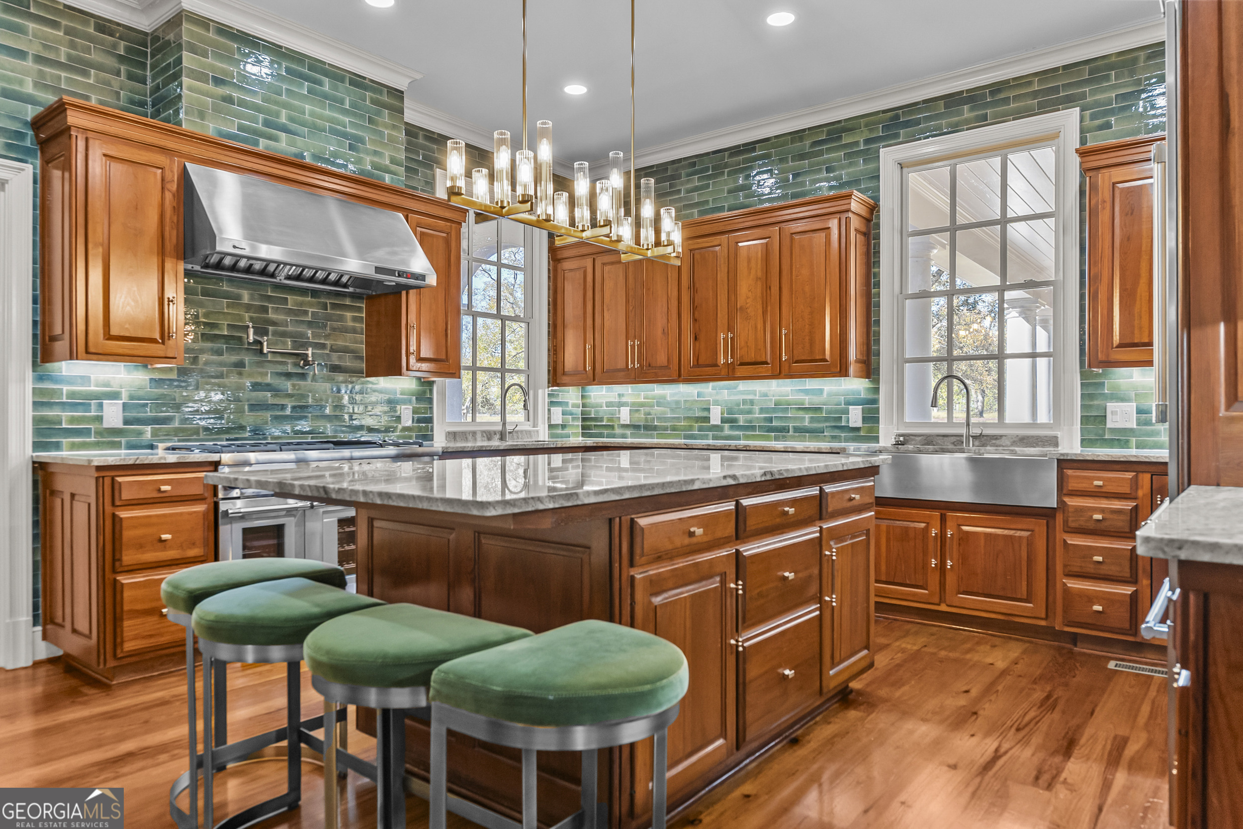 440 Ocilla Highway Fitzgerald, GA 31750 - Photo 29 of 96 a kitchen with stainless steel appliances a table and chairs in it