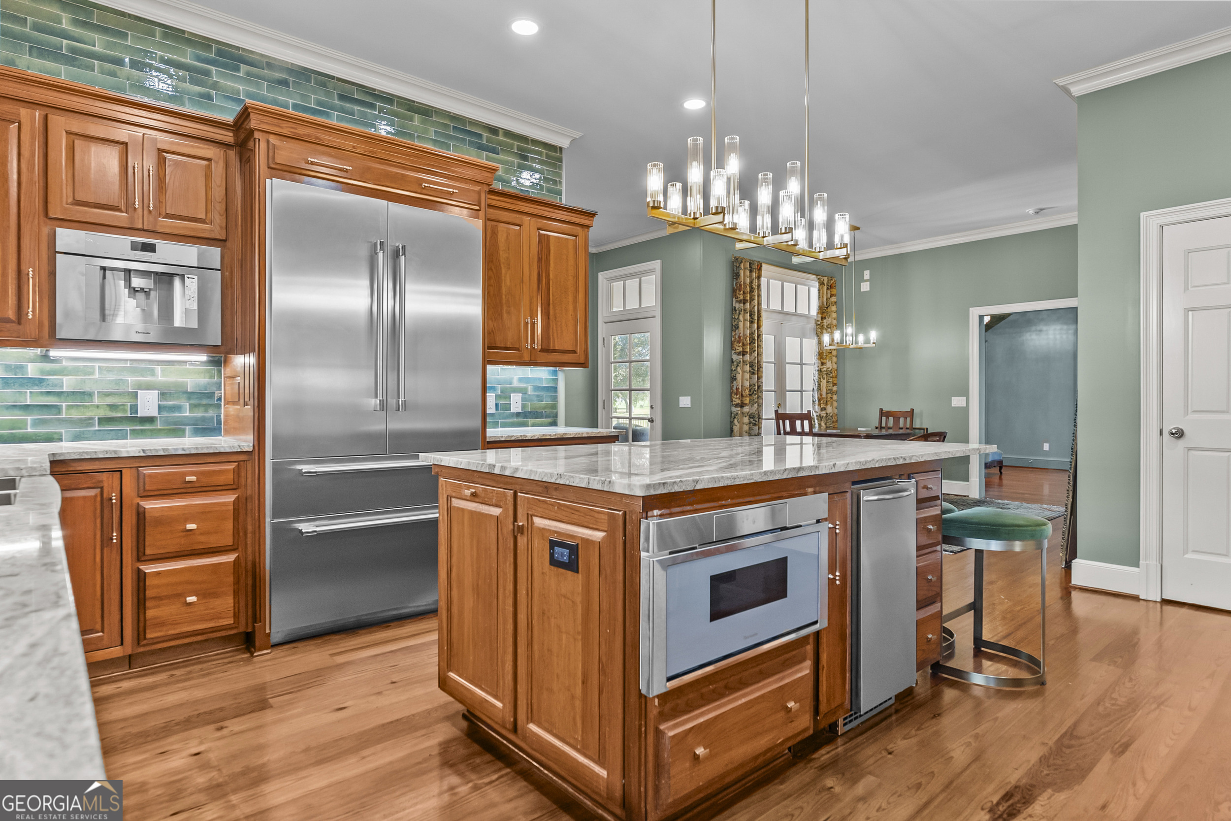 440 Ocilla Highway Fitzgerald, GA 31750 - Photo 31 of 96 a kitchen with stainless steel appliances granite countertop a stove a refrigerator and a wooden cabinets