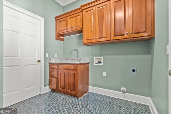 a bathroom with a granite countertop toilet a mirror and a sink