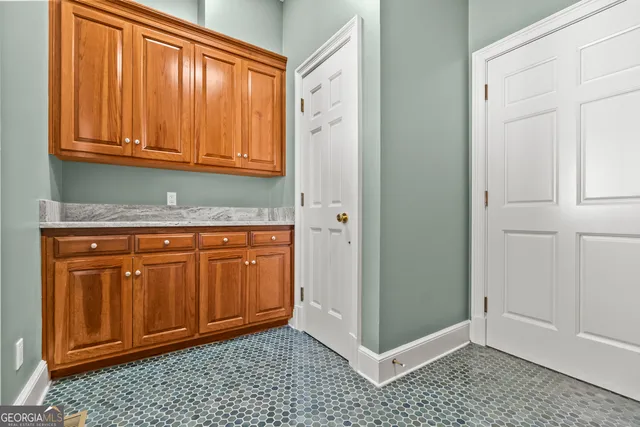 a bathroom with a granite countertop sink a bathtub and shower