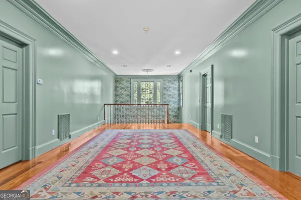 a view of a lake with a yard and mountain view