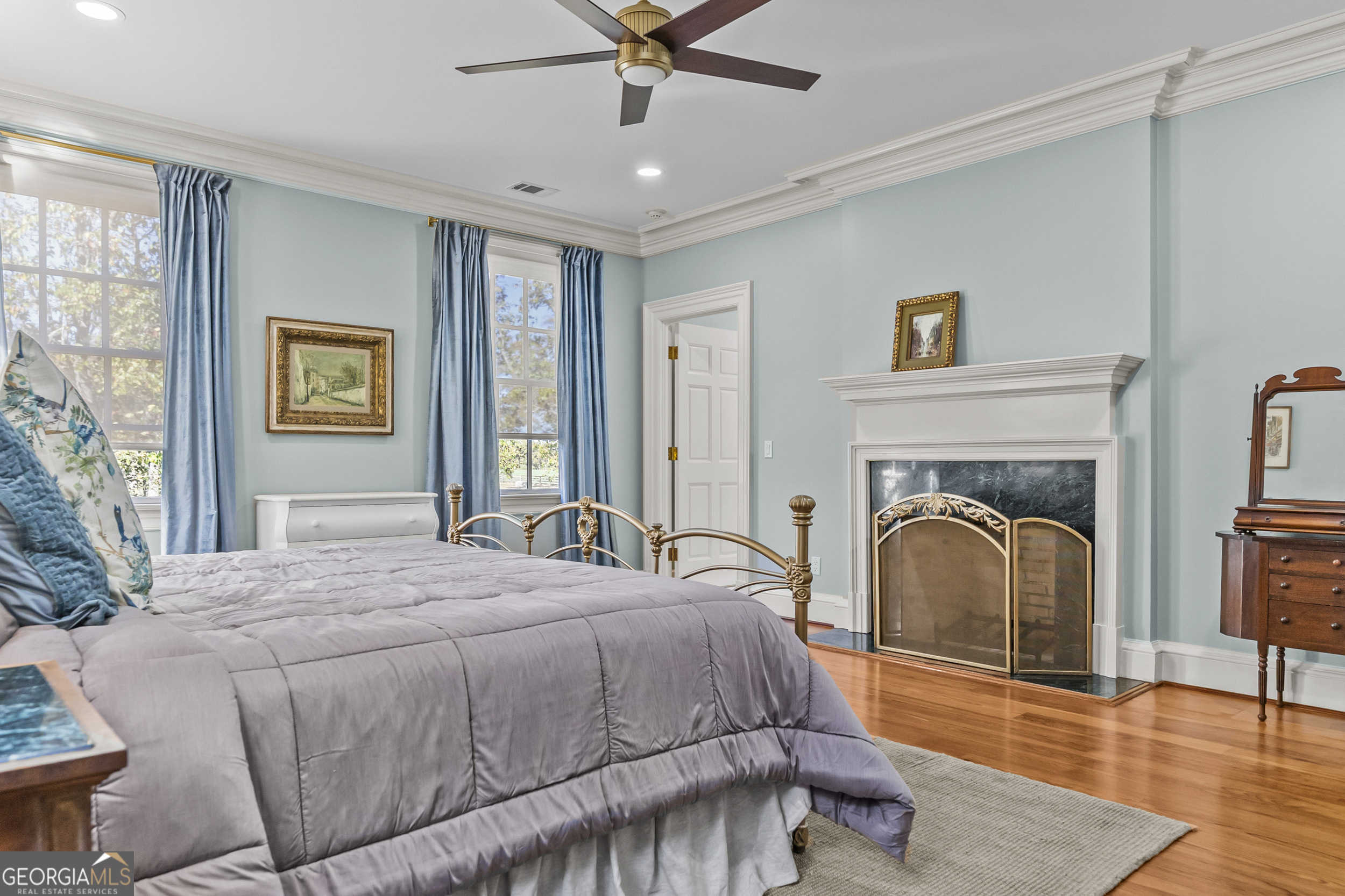 440 Ocilla Highway Fitzgerald, GA 31750 - Photo 48 of 96 a bedroom with a bed and a fireplace