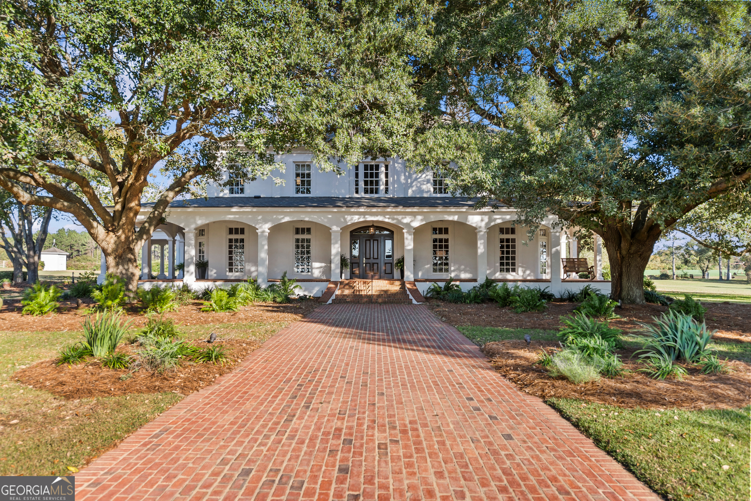 440 Ocilla Highway Fitzgerald, GA 31750 - Photo 5 of 96 a front view of a house with yard porch and outdoor seating