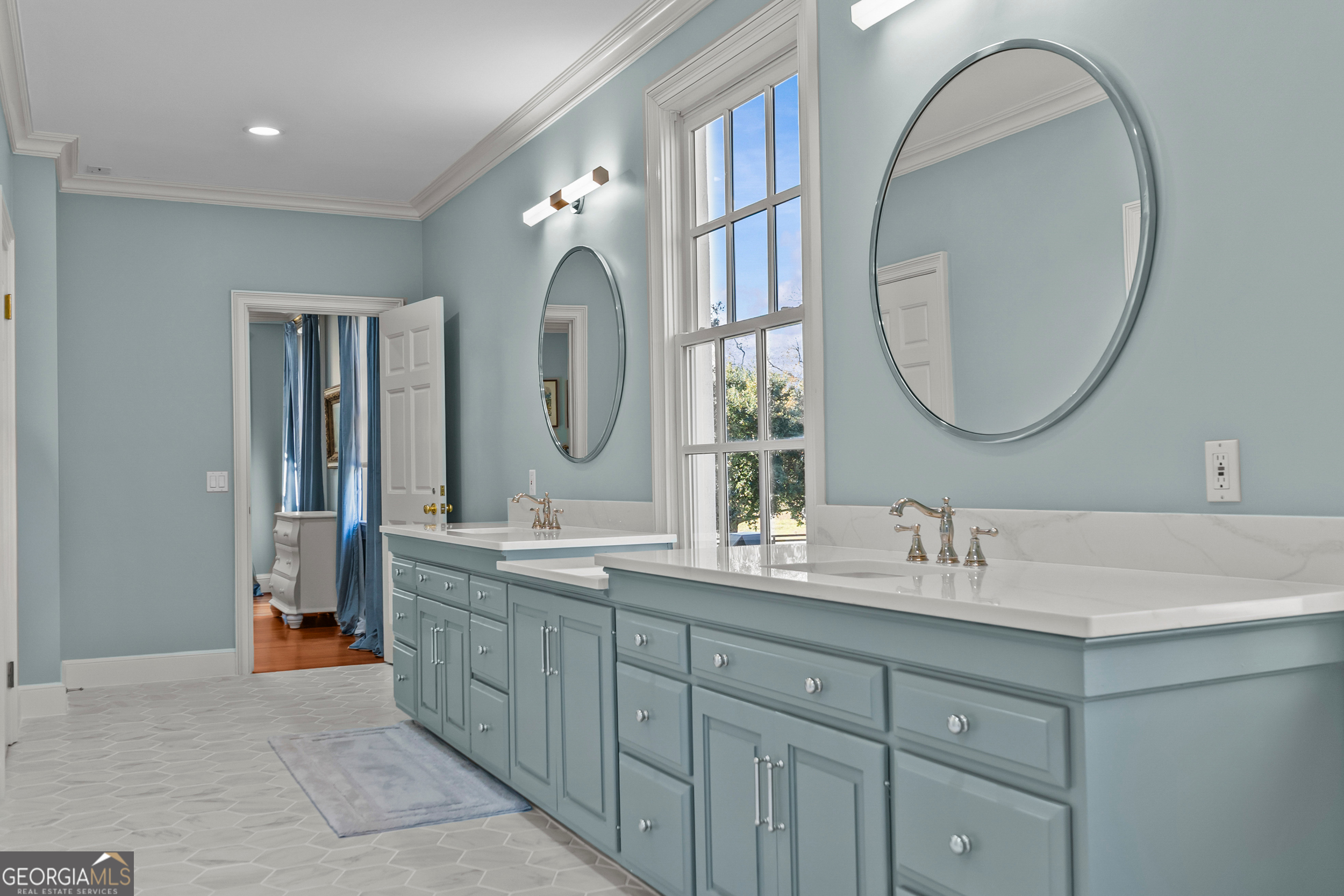 440 Ocilla Highway Fitzgerald, GA 31750 - Photo 52 of 96 a bathroom with a double vanity sink and a mirror