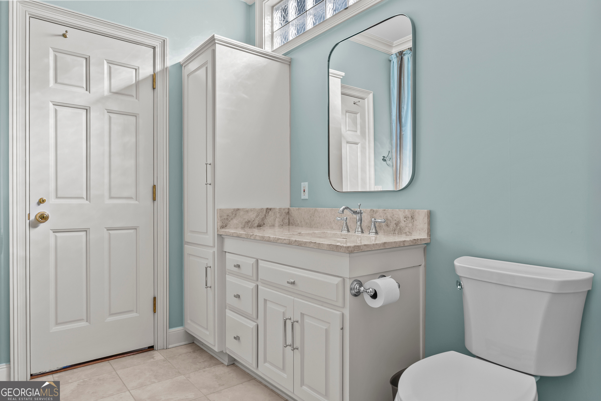 440 Ocilla Highway Fitzgerald, GA 31750 - Photo 63 of 96 a bathroom with a granite countertop toilet a mirror and a sink