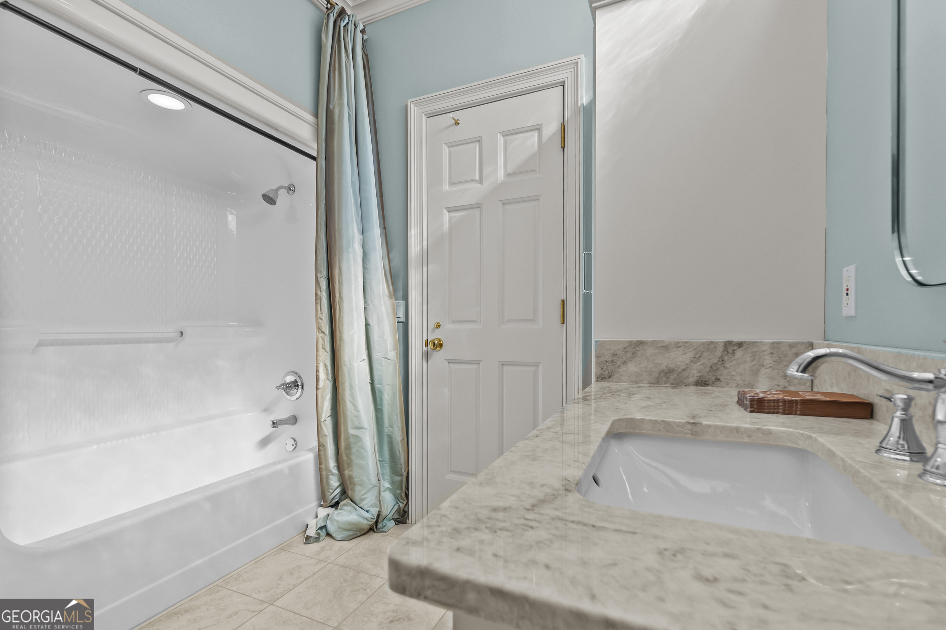 440 Ocilla Highway Fitzgerald, GA 31750 - Photo 64 of 96 a bathroom with a granite countertop sink a bathtub and shower