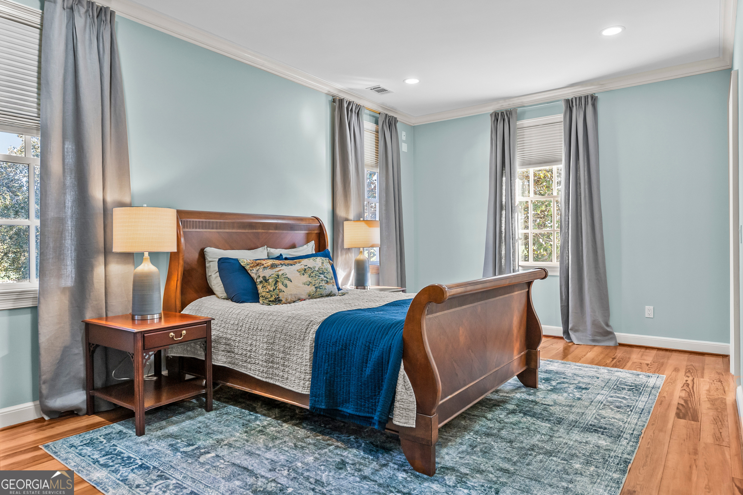 440 Ocilla Highway Fitzgerald, GA 31750 - Photo 66 of 96 a bedroom with a bed and wooden floor