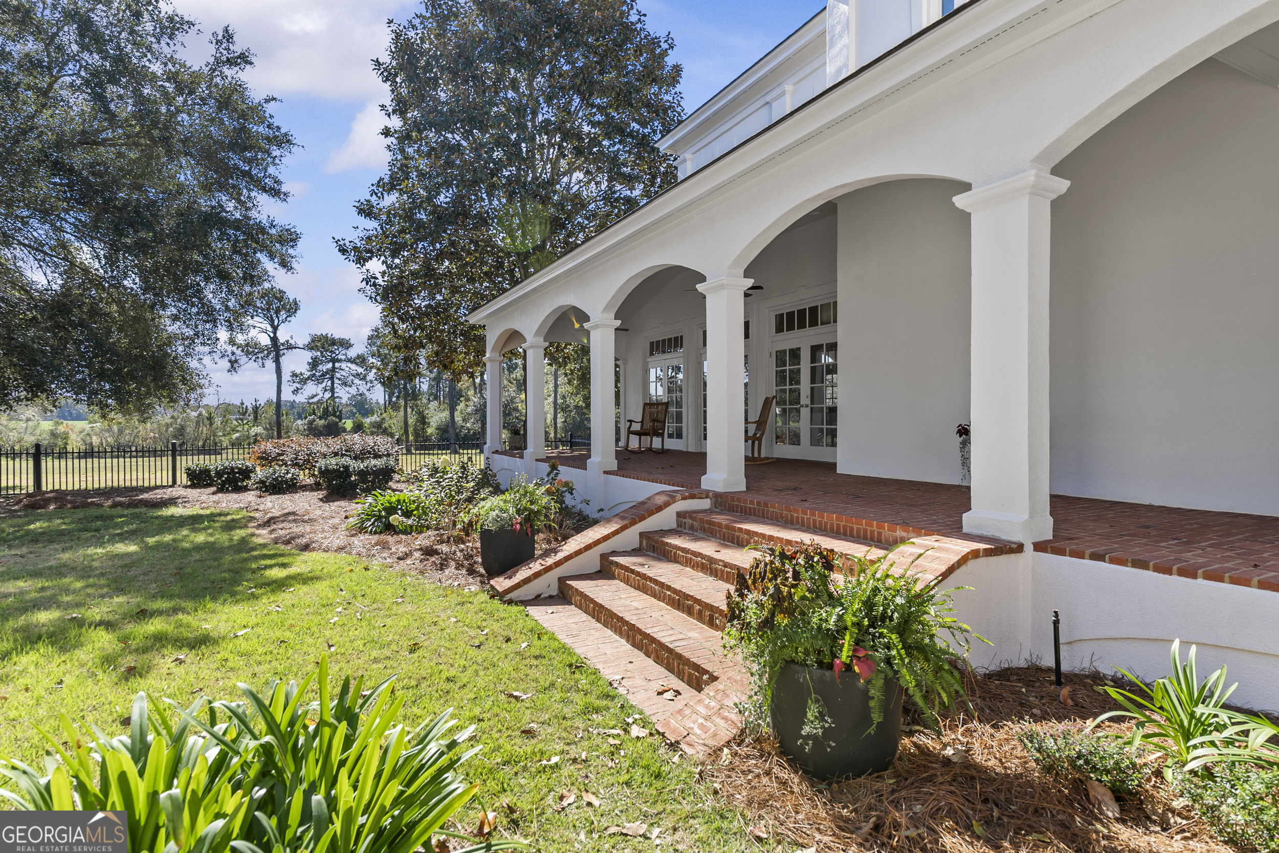 440 Ocilla Highway Fitzgerald, GA 31750 - Photo 76 of 96 a front view of a house with garden and porch