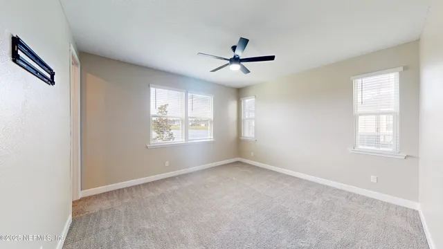 a view of empty room with windows