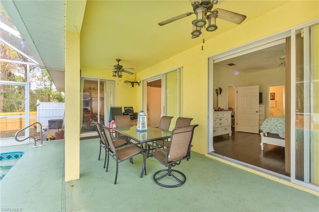 18258 Fuchsia Road Fort Myers, FL 33967 - Photo 18 of 22 a view of a dining room with furniture and a chandelier