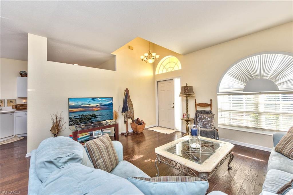 18258 Fuchsia Road Fort Myers, FL 33967 - Photo 4 of 22 a living room with furniture and a flat screen tv