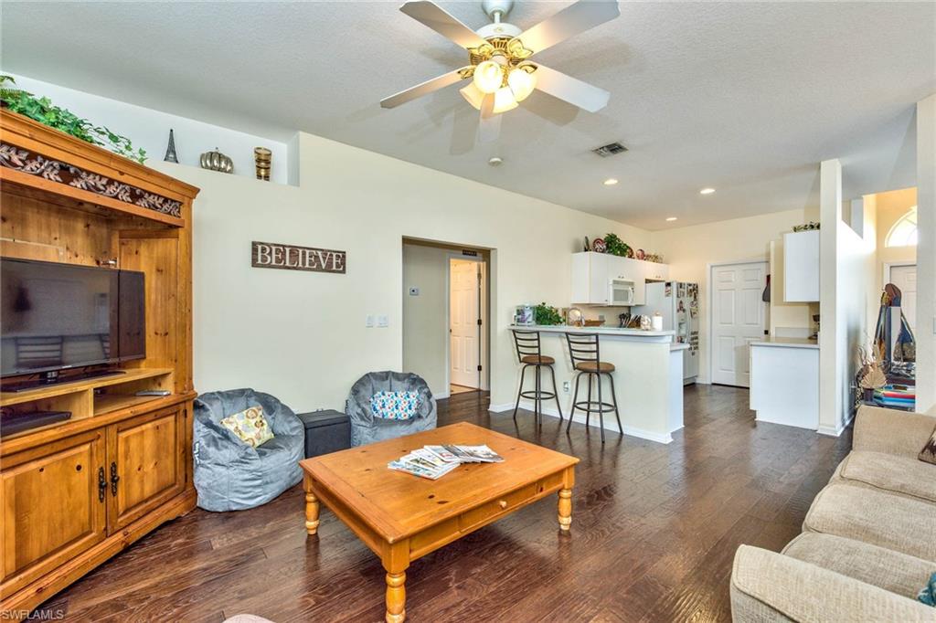 18258 Fuchsia Road Fort Myers, FL 33967 - Photo 10 of 22 a living room with furniture and a flat screen tv