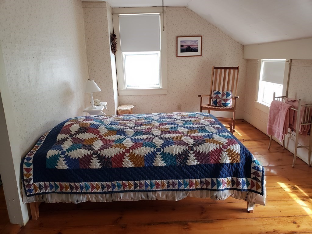 6 Northeast Fitzwilliam Road Royalston, MA 01368 - Photo 13 of 21 a bed sitting in a bedroom next to a window