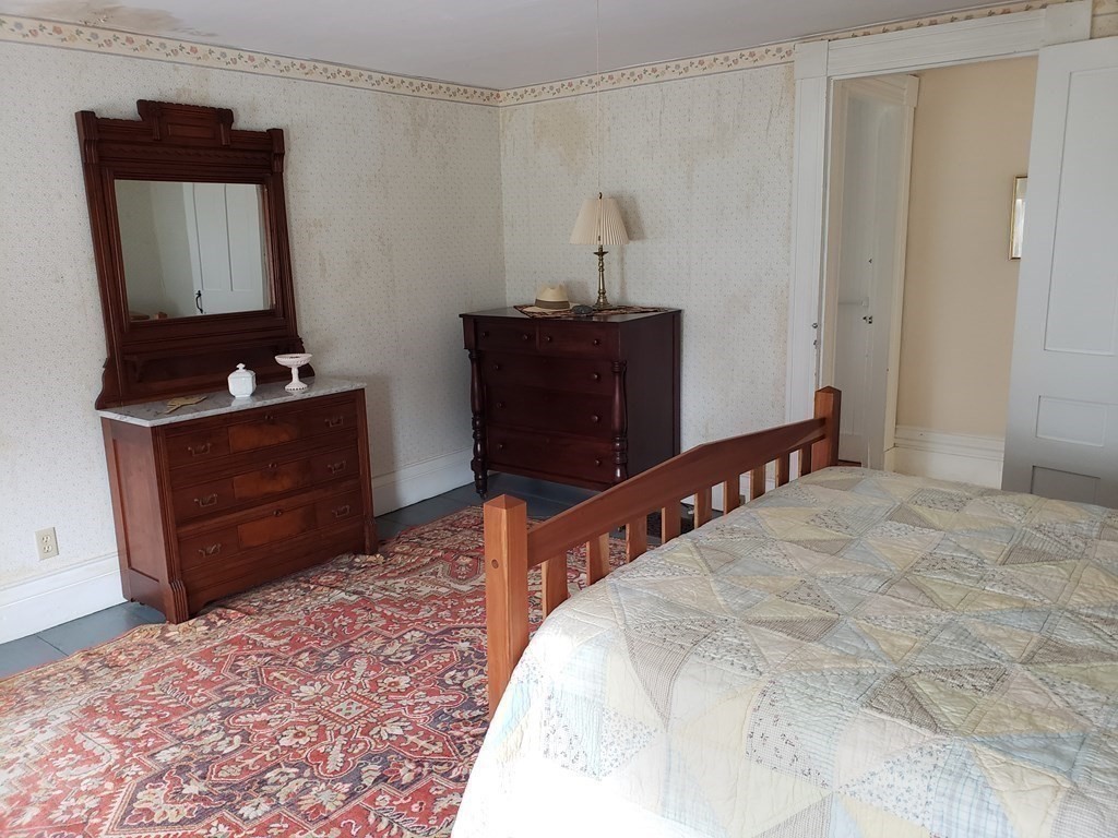 6 Northeast Fitzwilliam Road Royalston, MA 01368 - Photo 15 of 21 a bedroom with a bed and a dresser