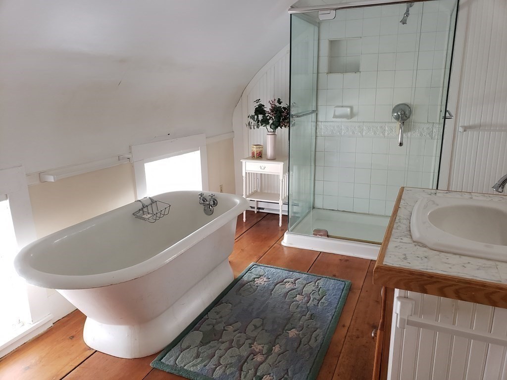 6 Northeast Fitzwilliam Road Royalston, MA 01368 - Photo 18 of 21 a large white tub sitting next to a bathroom sink