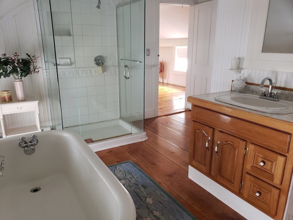 6 Northeast Fitzwilliam Road Royalston, MA 01368 - Photo 19 of 21 a bathroom with a tub sink and mirror