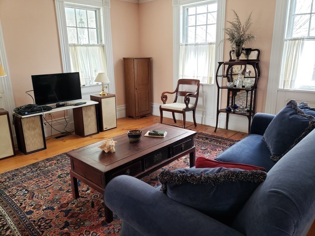 6 Northeast Fitzwilliam Road Royalston, MA 01368 - Photo 5 of 21 a living room with furniture a flat screen tv and a window