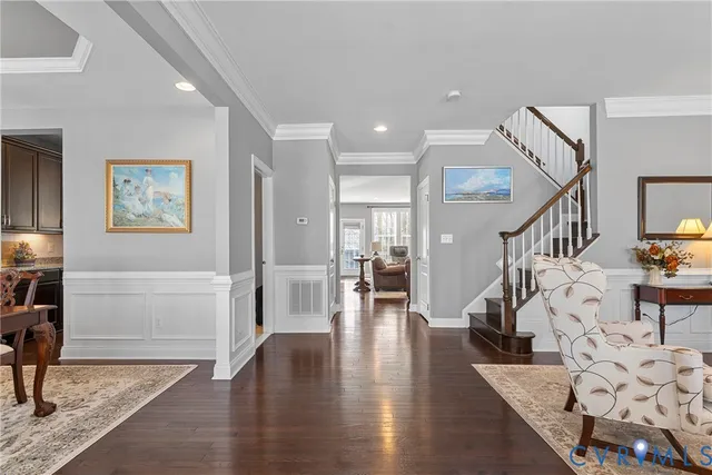 a view of entryway with livingroom and wooden floor