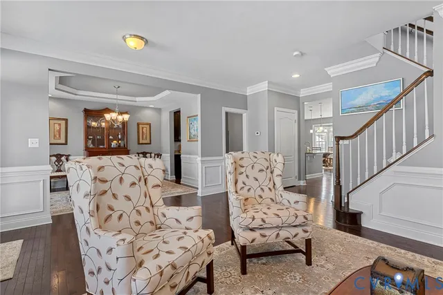 a view of a livingroom with furniture and wooden floor