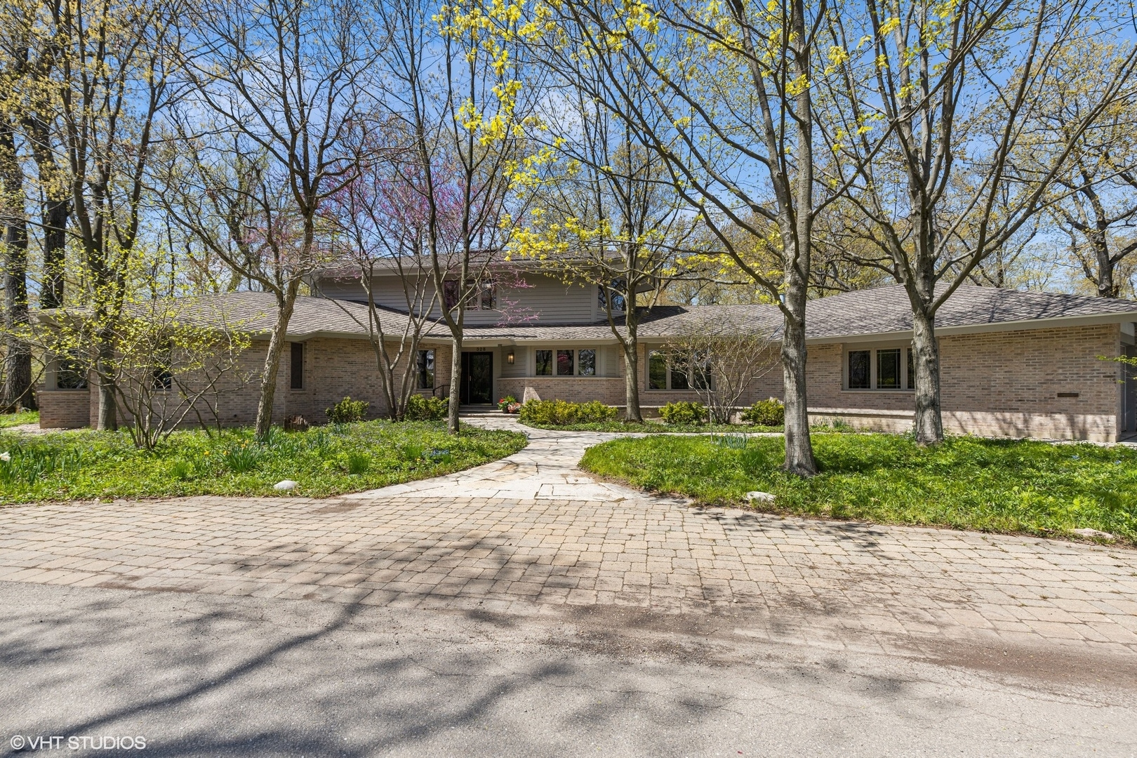 front view of a house with a yard