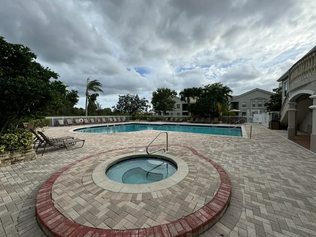 a view of swimming pool from a balcony