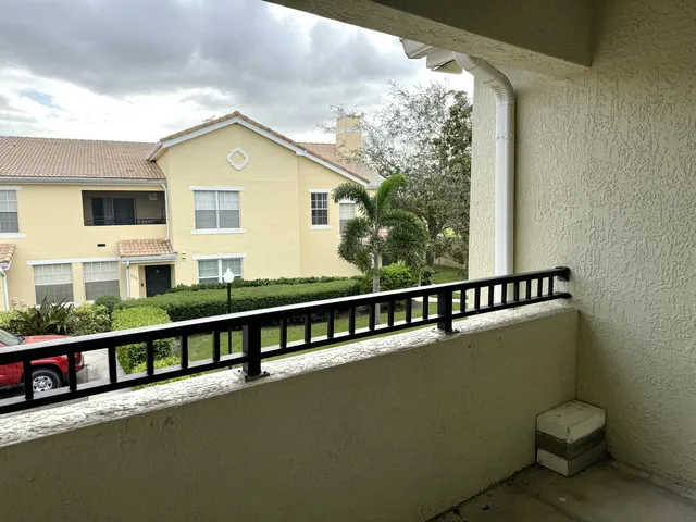 a view of balcony with furniture