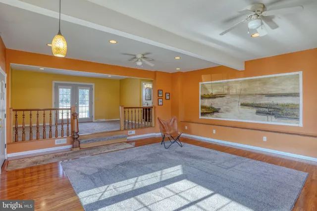 a living room with fireplace furniture and a flat screen tv