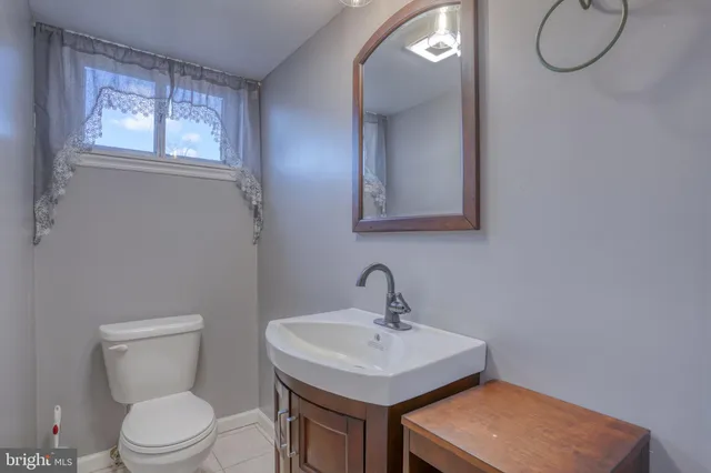 a kitchen with a sink a counter top space and cabinets