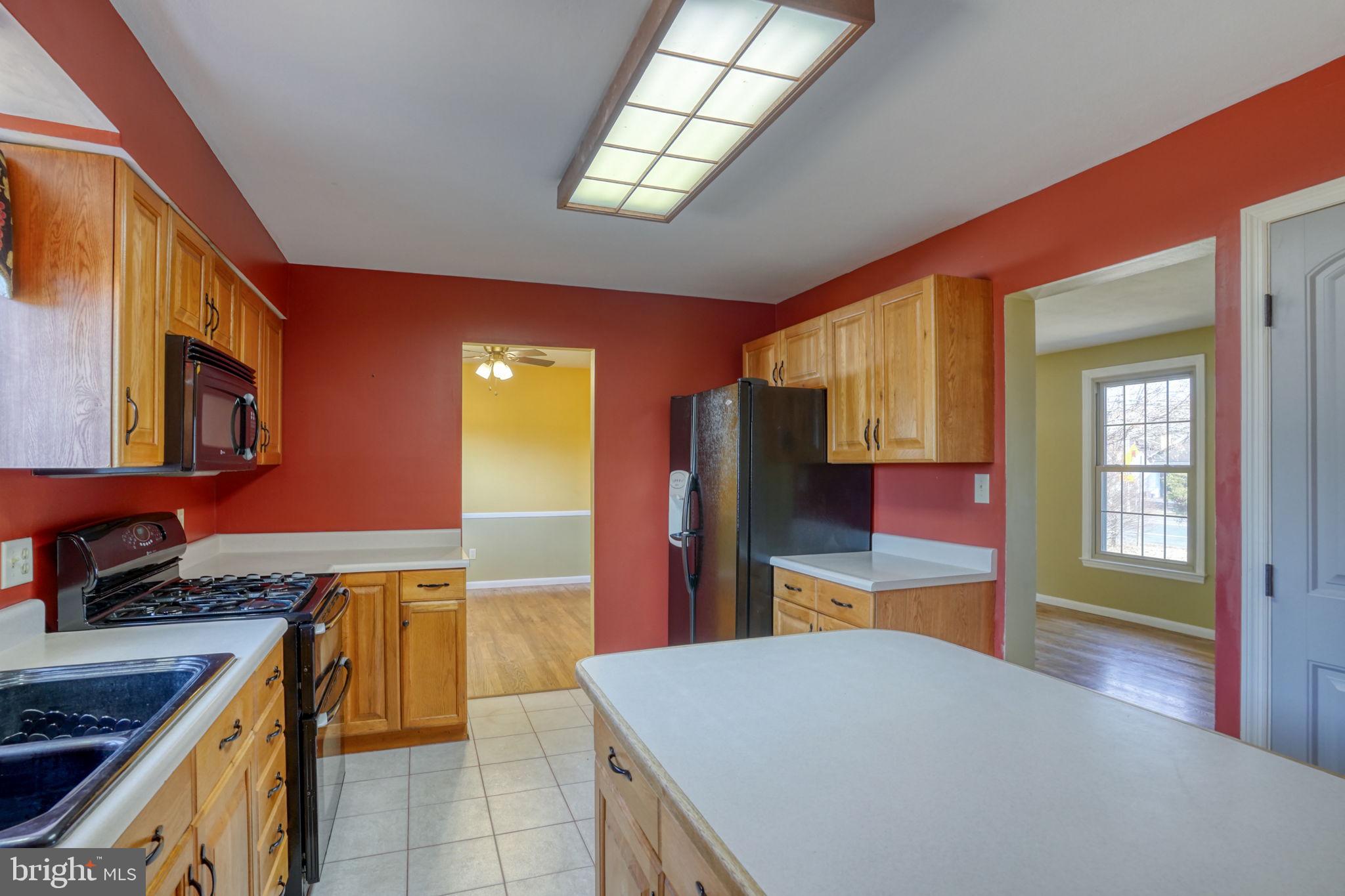 2158 South State Street Dover, DE 19901 - Photo 21 of 51 a kitchen with stainless steel appliances granite countertop a stove a sink and a refrigerator