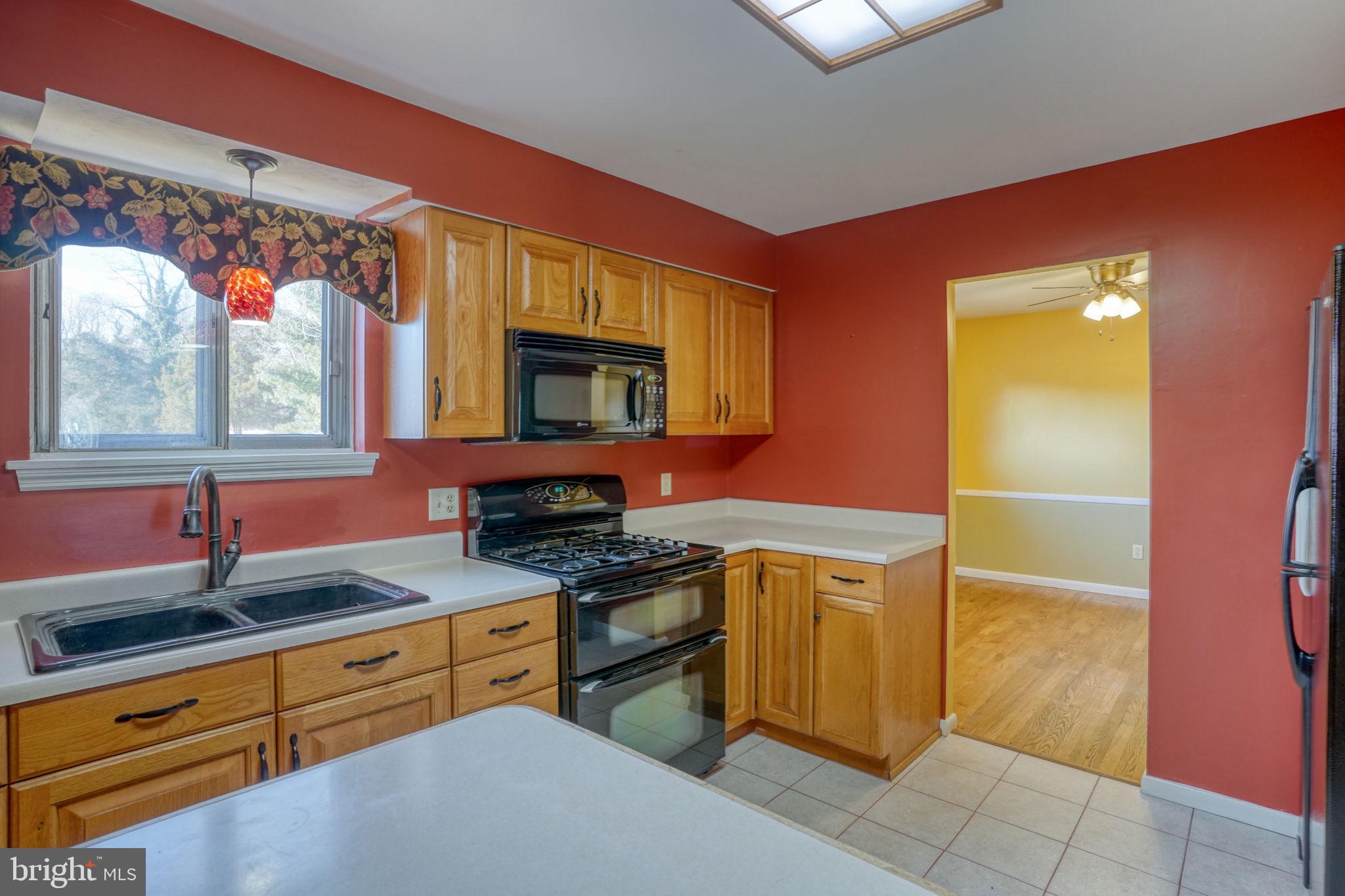 2158 South State Street Dover, DE 19901 - Photo 22 of 51 a kitchen that has a sink and a stove in it