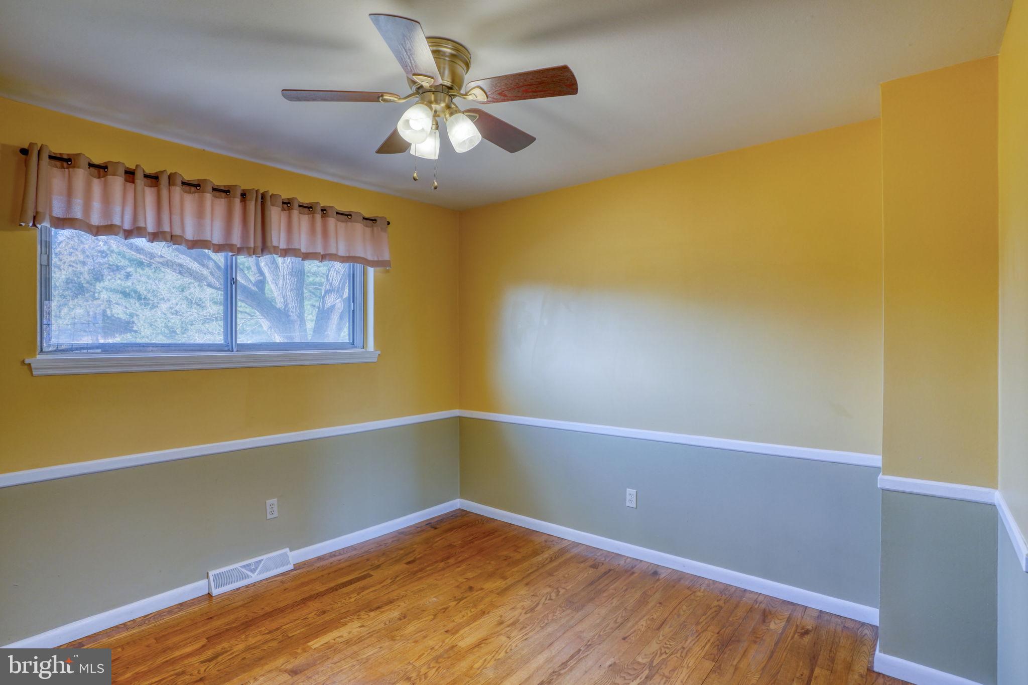 2158 South State Street Dover, DE 19901 - Photo 26 of 51 a view of an empty room with a window and a ceiling fan