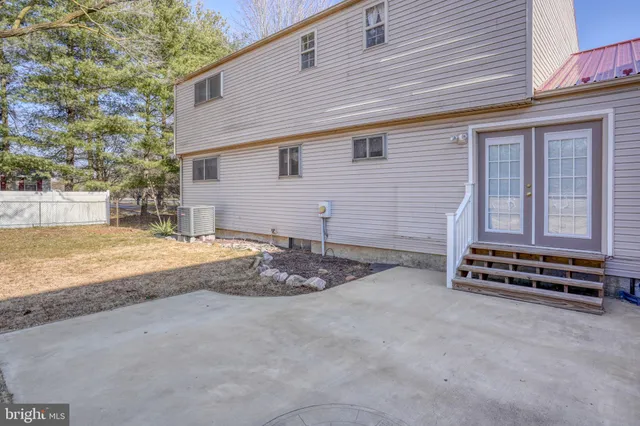 a front view of brick house with large windows