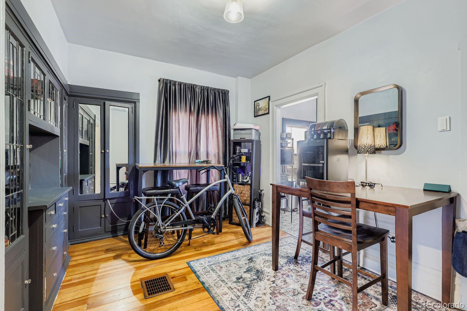 854 North Clarkson Street Denver, CO 80218 - Photo 13 of 34 a view of a livingroom with furniture and a window