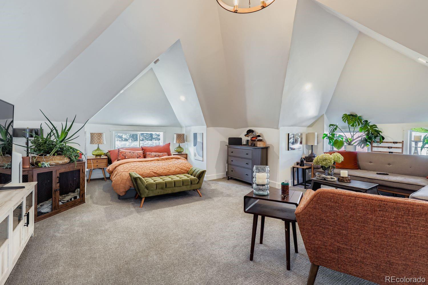 854 North Clarkson Street Denver, CO 80218 - Photo 15 of 34 a bedroom with furniture and a potted plant