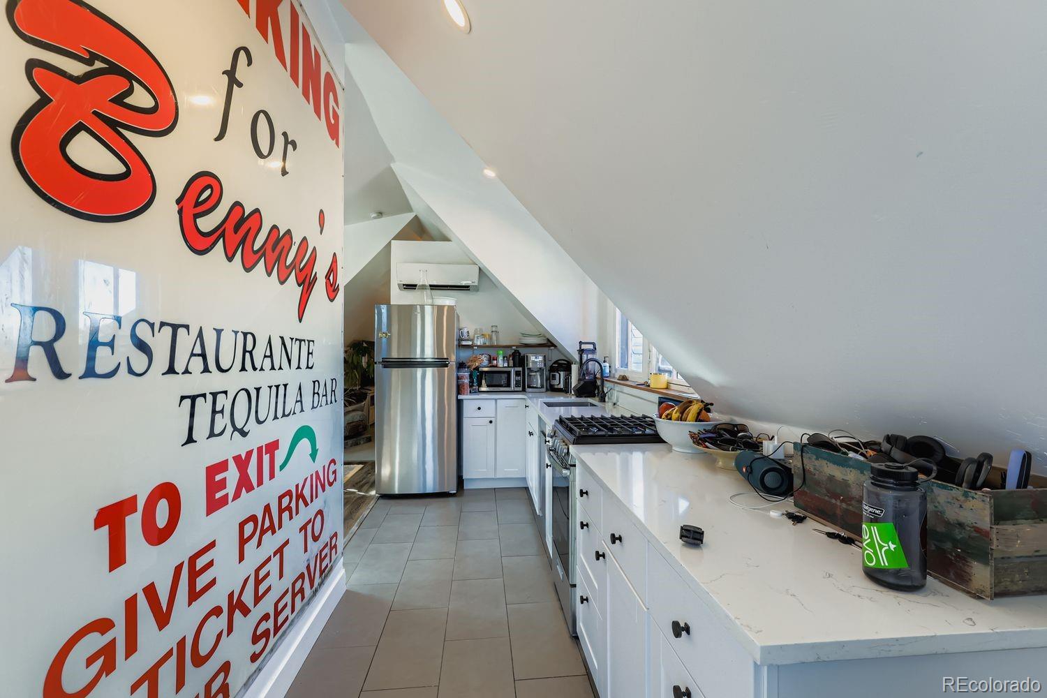 854 North Clarkson Street Denver, CO 80218 - Photo 19 of 34 a room with lots of white appliances and cabinets