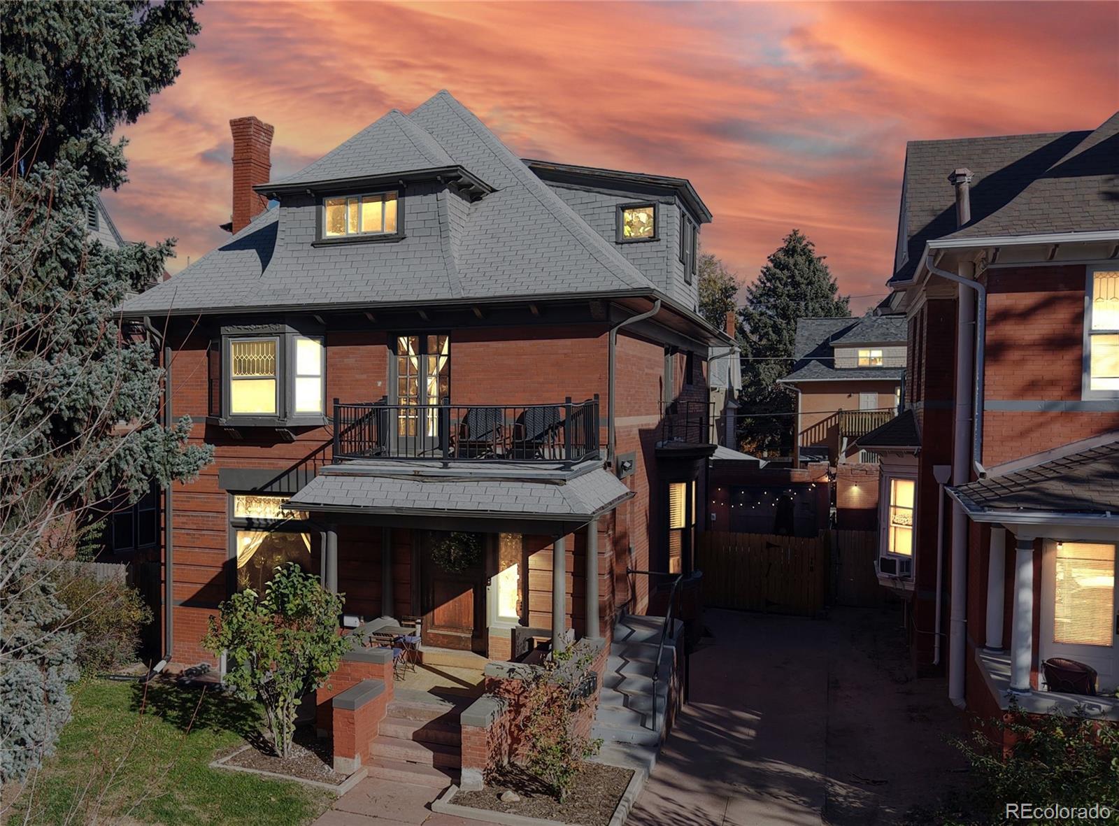 854 North Clarkson Street Denver, CO 80218 - Photo 2 of 34 a front view of a house with a yard