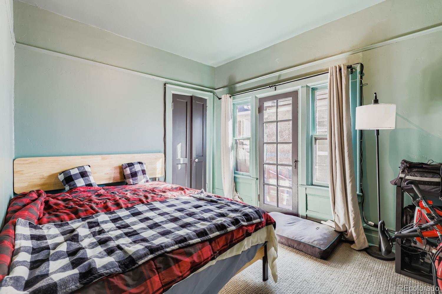 854 North Clarkson Street Denver, CO 80218 - Photo 7 of 34 a bedroom with a bed and a window