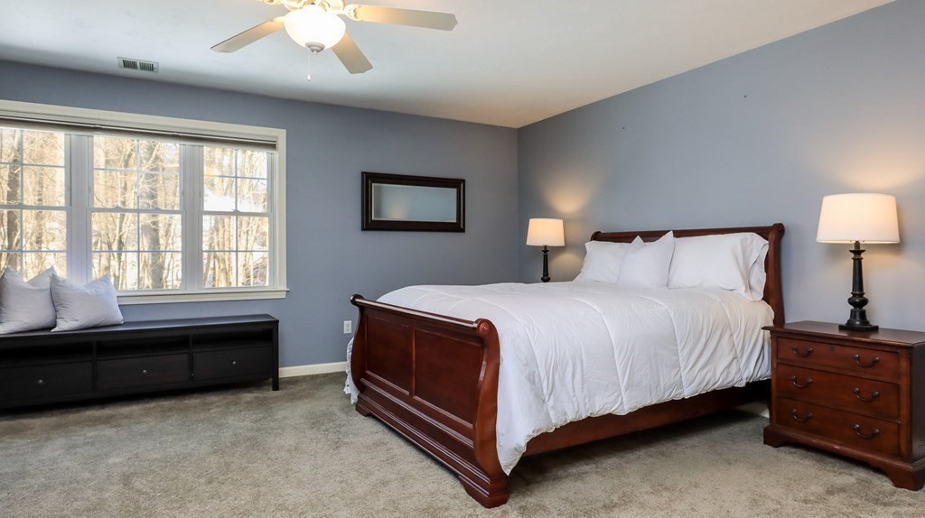 85 Dudley Road, Unit 85 Berlin, MA 01503 - Photo 22 of 39 a bedroom with a bed and a window