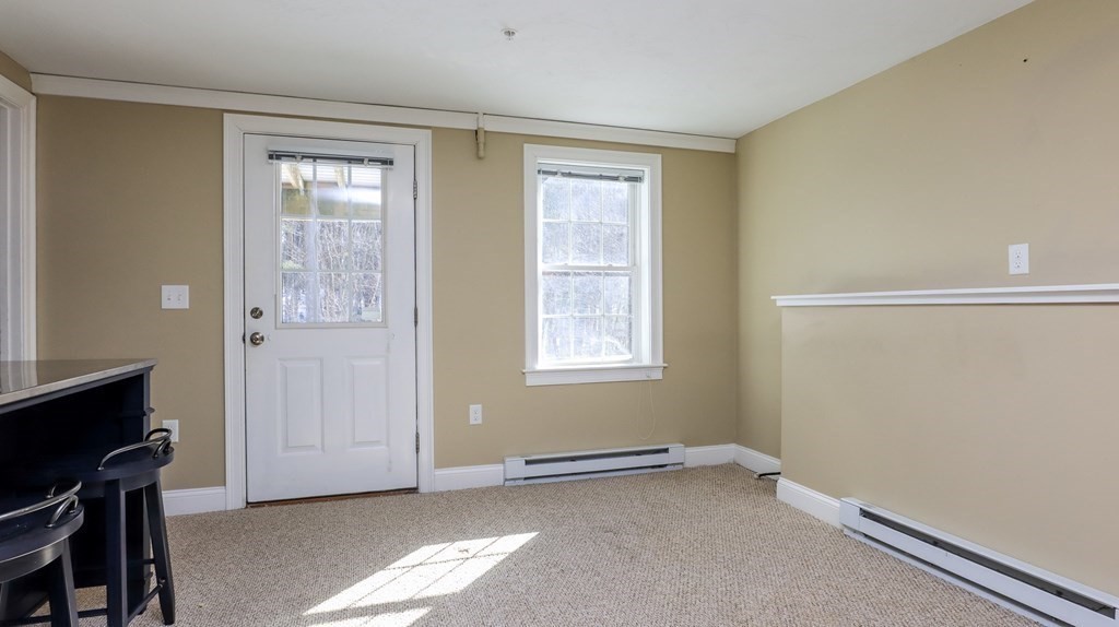 85 Dudley Road, Unit 85 Berlin, MA 01503 - Photo 27 of 39 a view of an empty room with a window