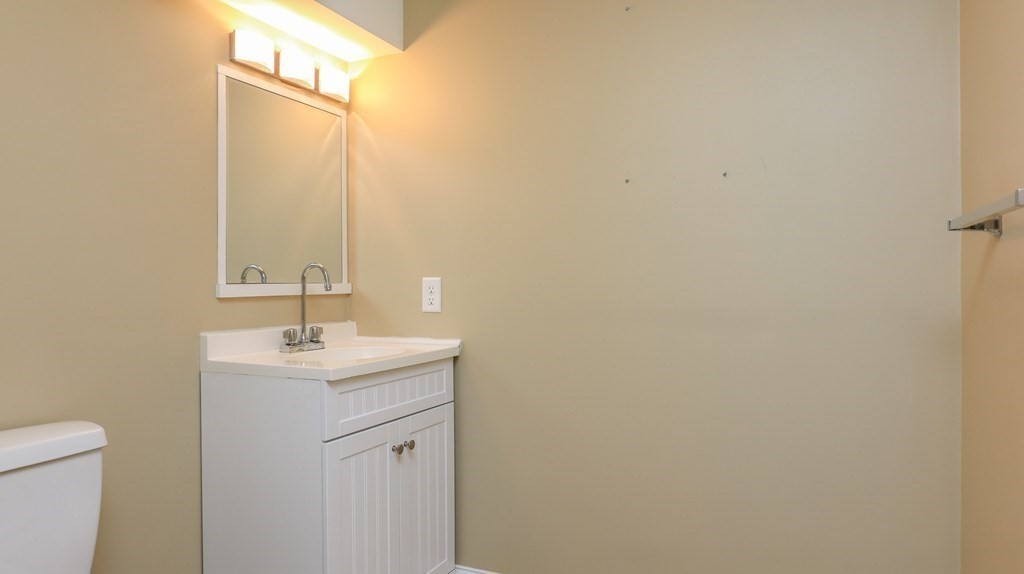 85 Dudley Road, Unit 85 Berlin, MA 01503 - Photo 30 of 39 a bathroom with a sink and a mirror